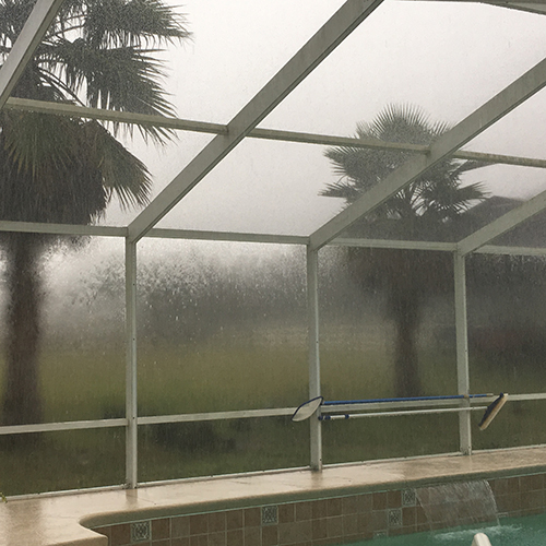 Pool enclosure during hurricane storm